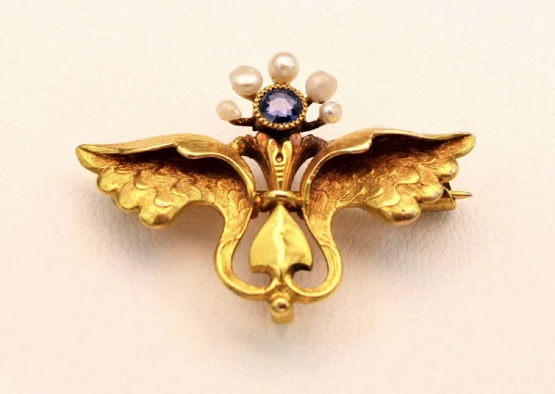 Unique Brooch for Evening Parties-14K yellow gold Mercury-themed brooch with one Sapphire and 5 seed pearls